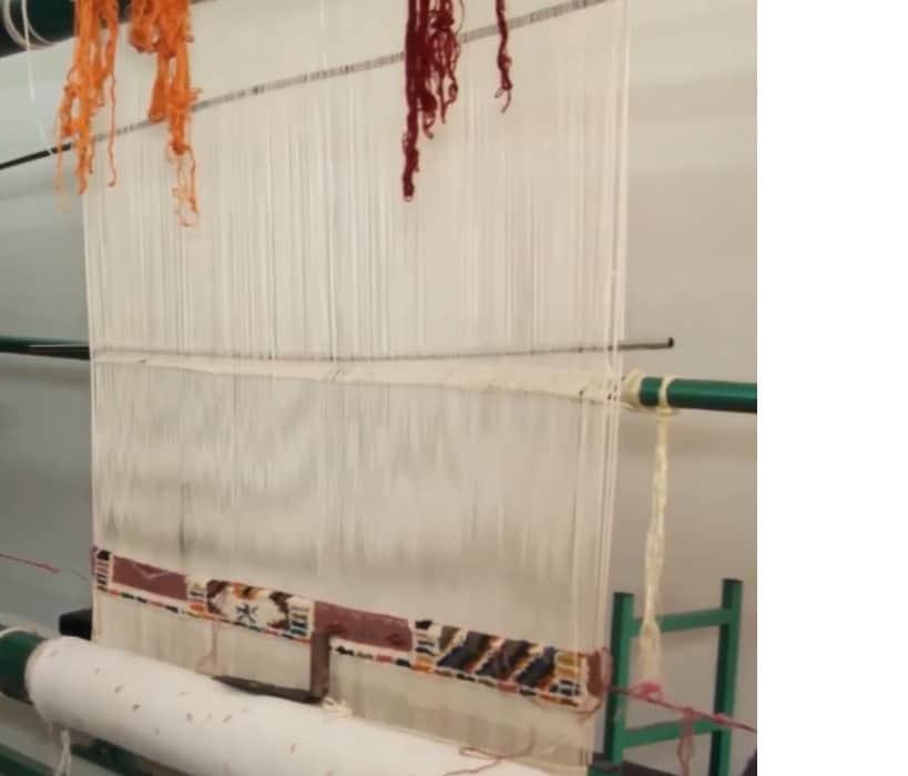 Close view of a handwoven Berber rug on a loom